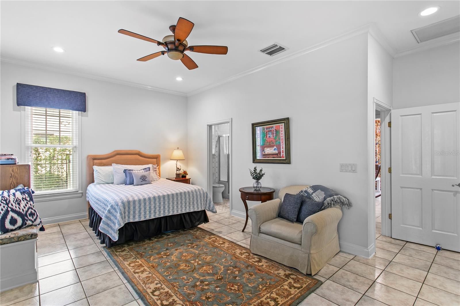 The mother-in-law suite features a bedroom with ensuite bath, living room, full kitchen, and informal dining area — ideal for multigenerational living, guests, or an au pair.