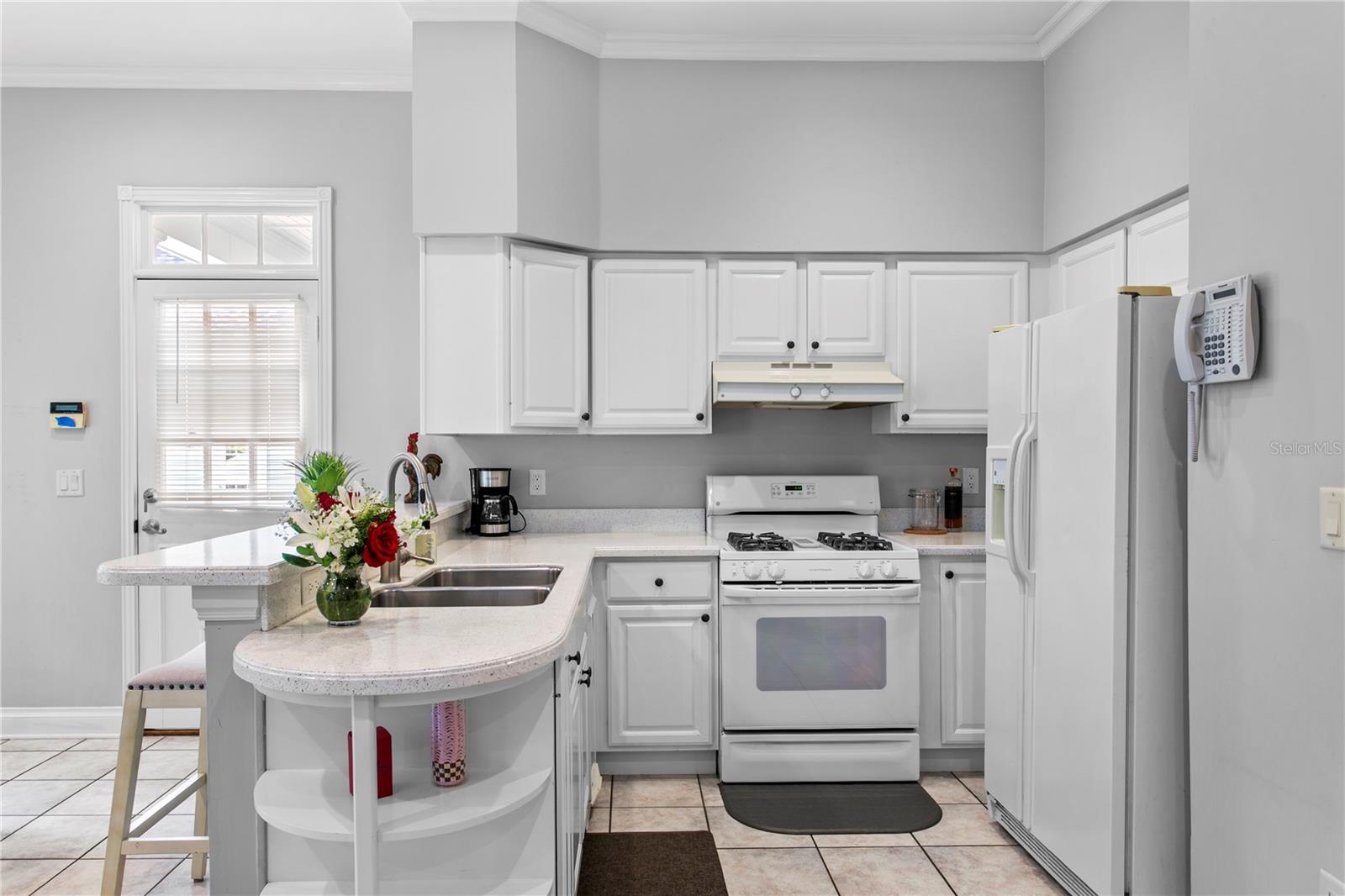 The full kitchen in the mother-in-law suite is perfect for holiday gatherings, offering extra ovens, generous counter space, and comfortable guest accommodations.