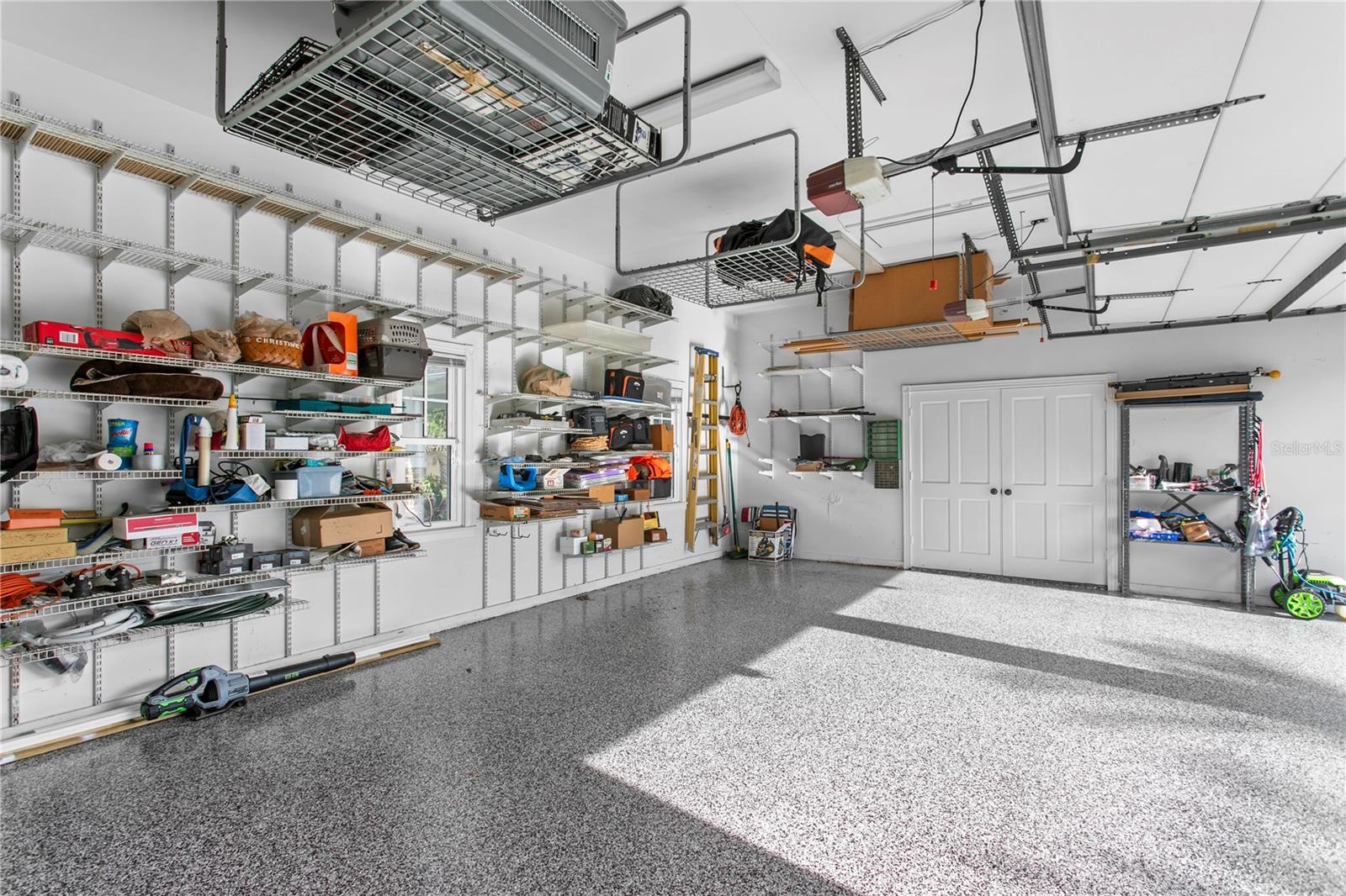 Through the double doors at the end of the garage bay, you’ll find a versatile flex space ideal for a home gym, workshop, or office.