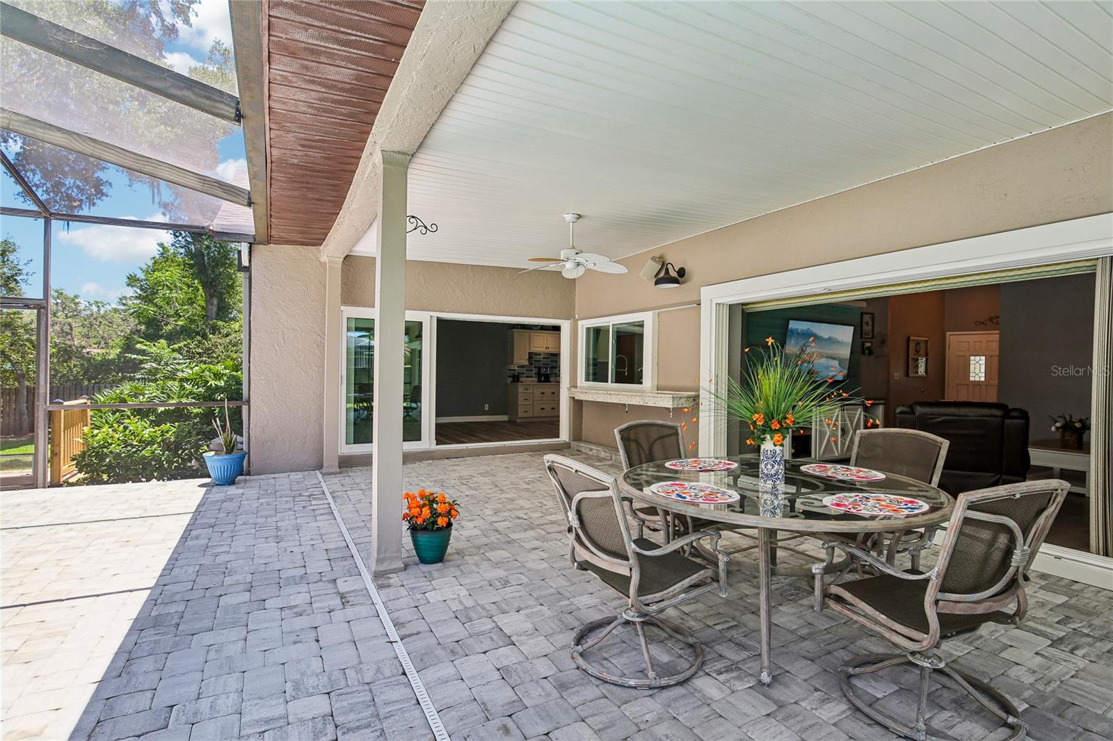Gorgeous Lanai with stunning pavers.  View with pocket sliders open