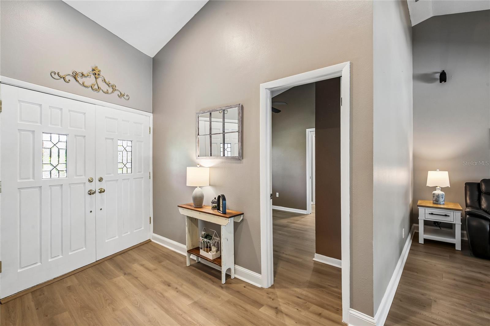 Foyer with view for gorgeous front double doors
