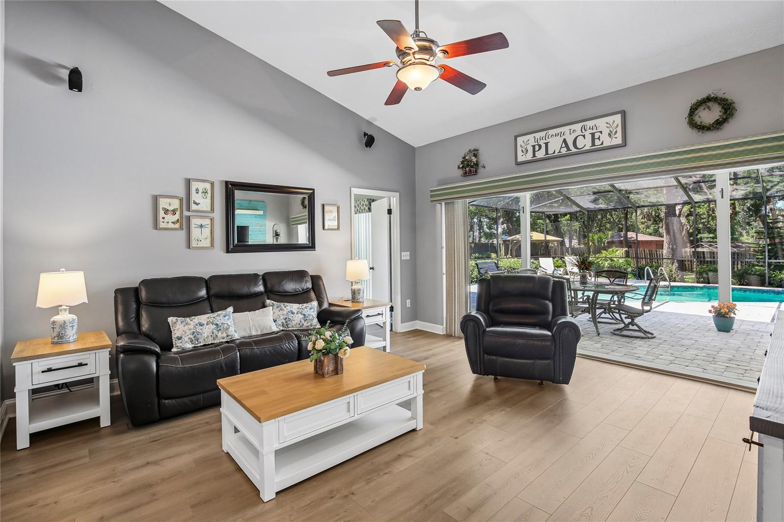 Living Room with pocket sliders that open the back of the home to the lanai