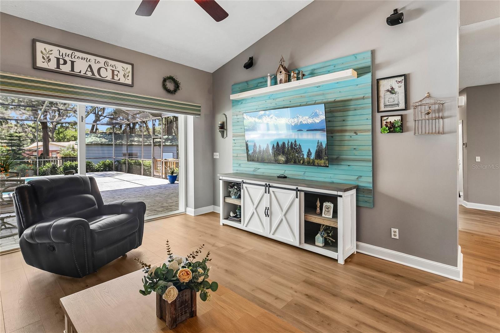 Living Room with pocket sliders that open the back of the home to the lanai