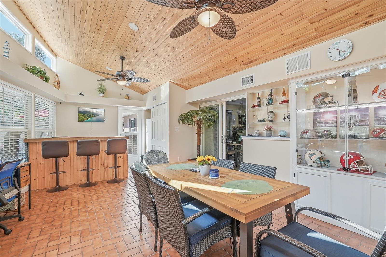 heated and cooled Florida room with lots of windows to view the backyard