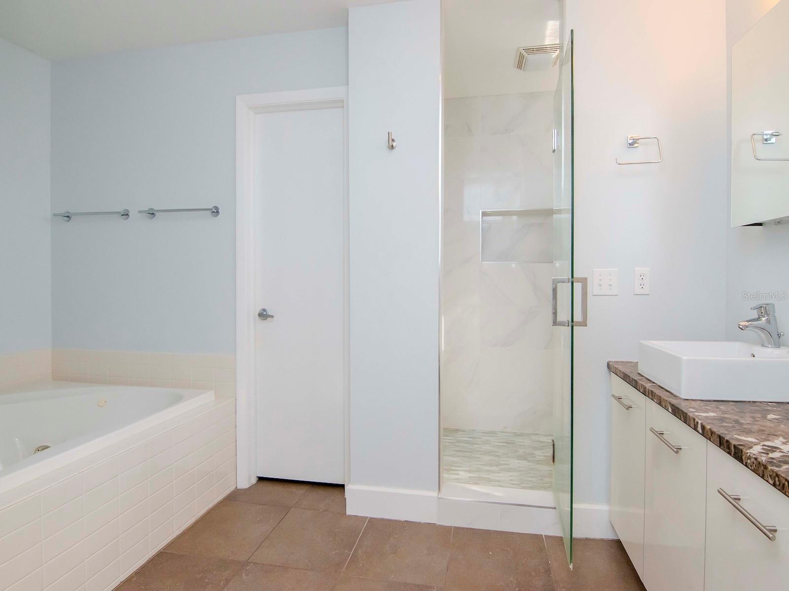 3rd level - Owners bath with soaking tub, dual vanities, and remodeled walk-in shower.