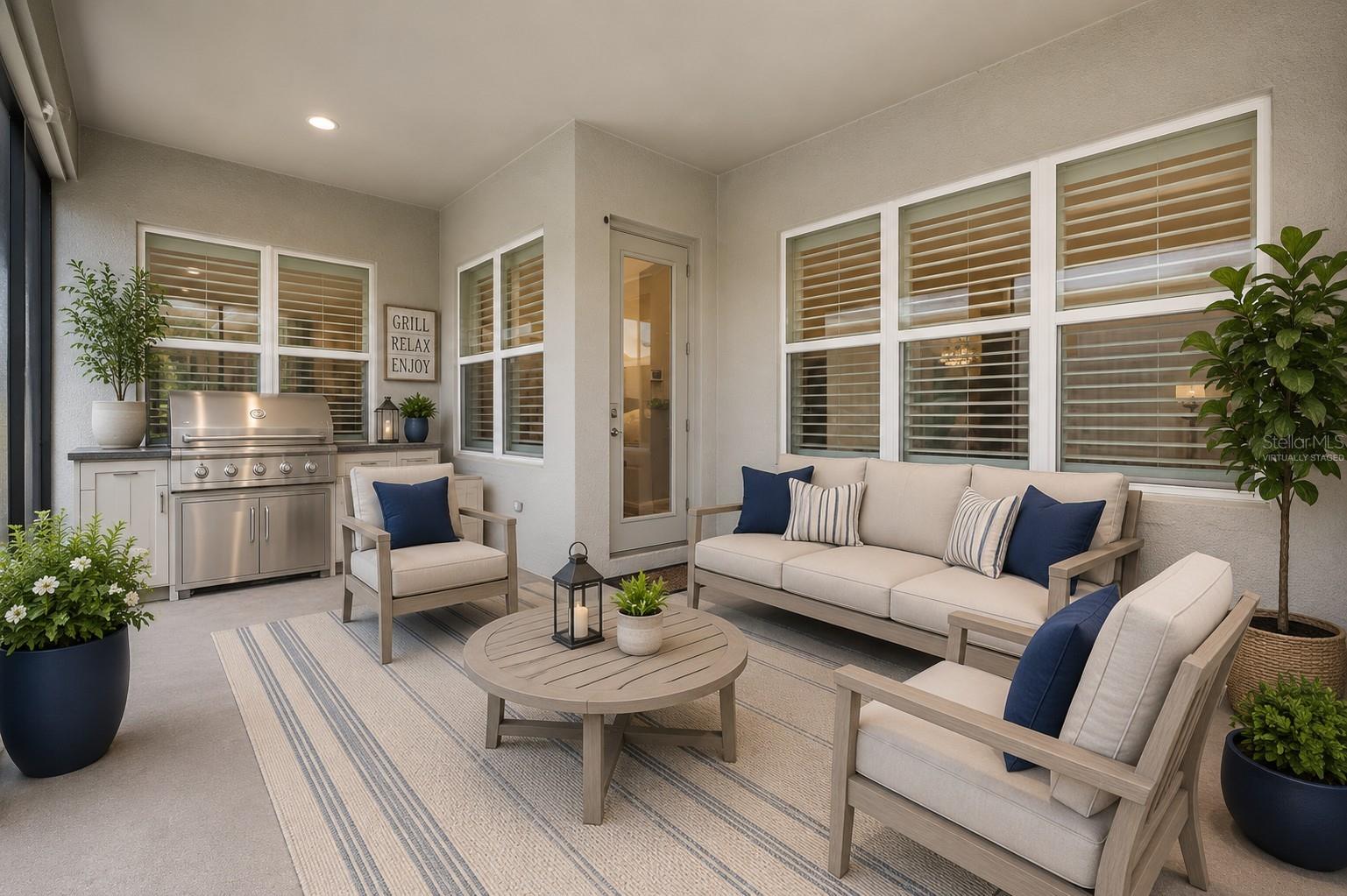 Screened in patio with plenty of room for your BBQ and patio furniture (virtually staged)