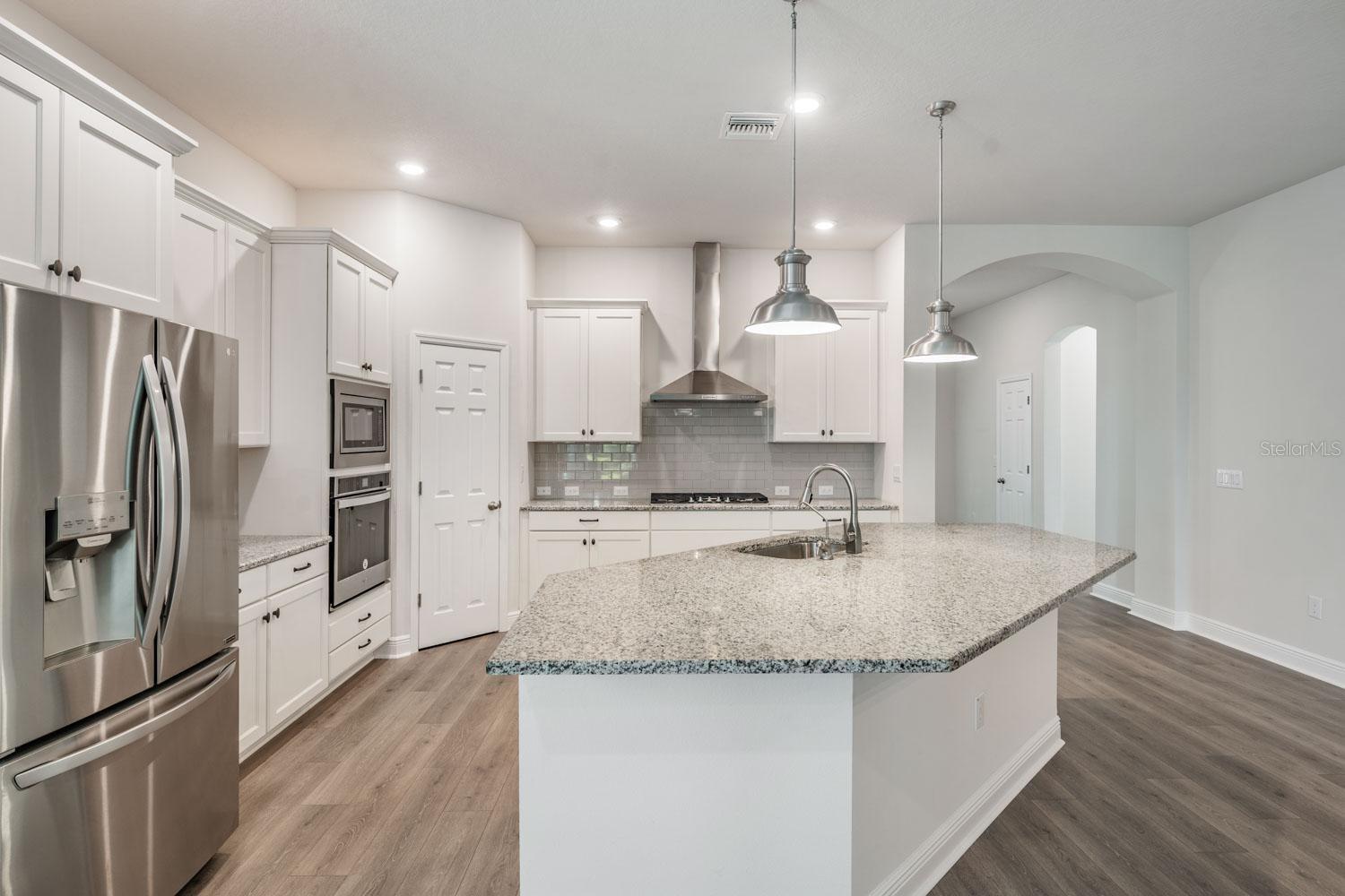 Bright kitchen with breakfast bar seating