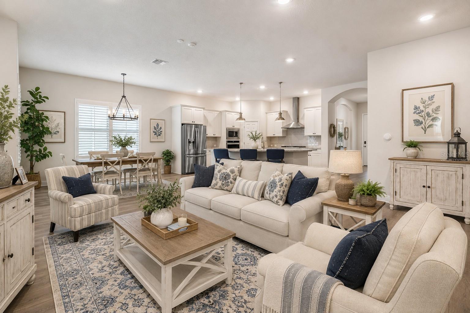 Great room opens to kitchen (virtually staged)
