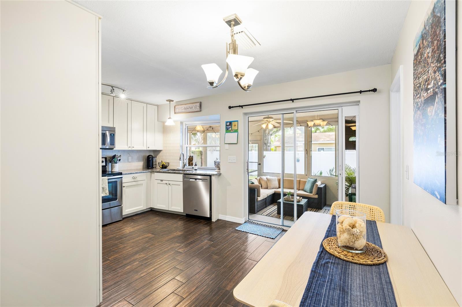 Kitchen has pass through window to the lanai bar
