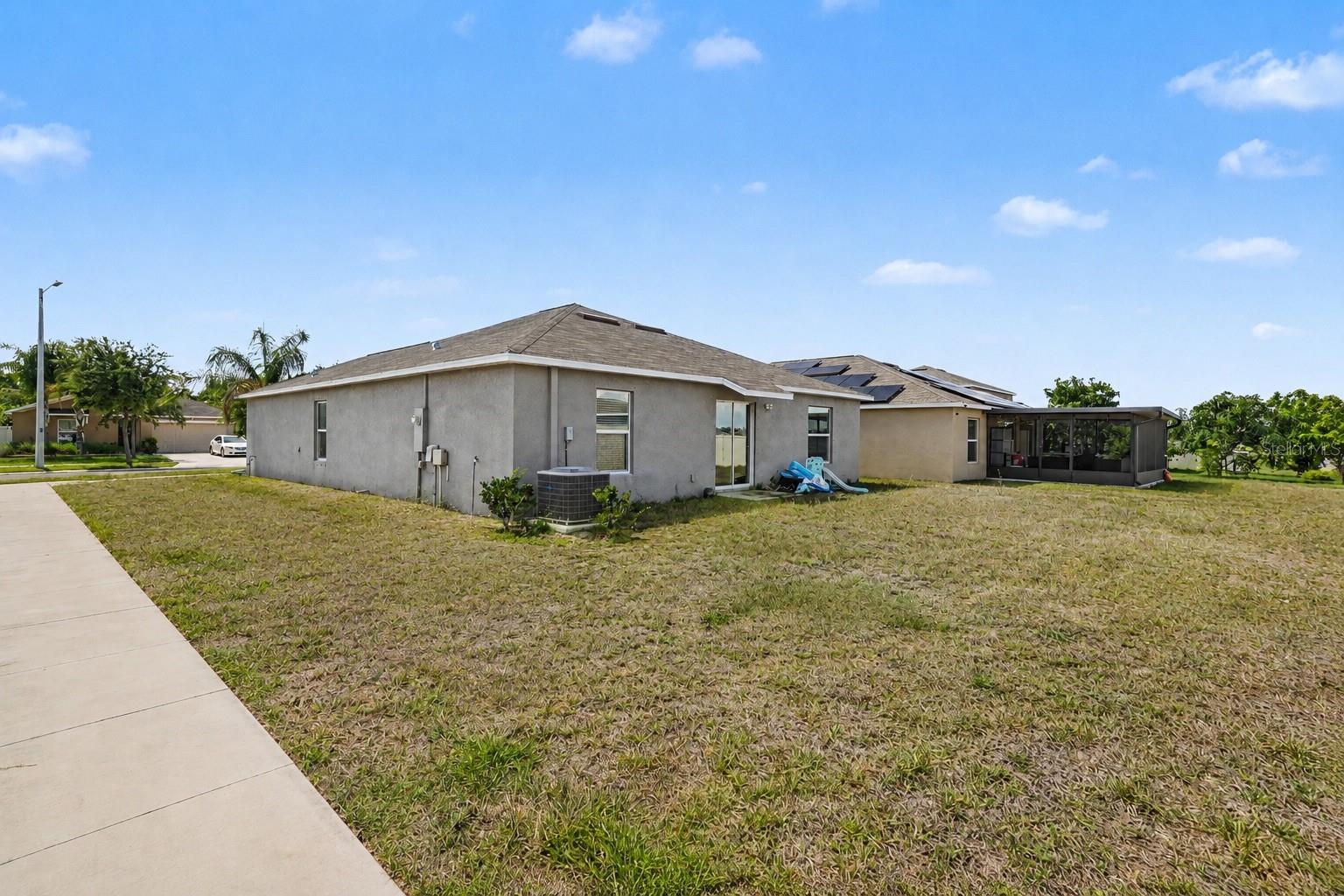 1733 Broad Winged Hawk Drive, Ruskin FL 33570 - Backyard and side view