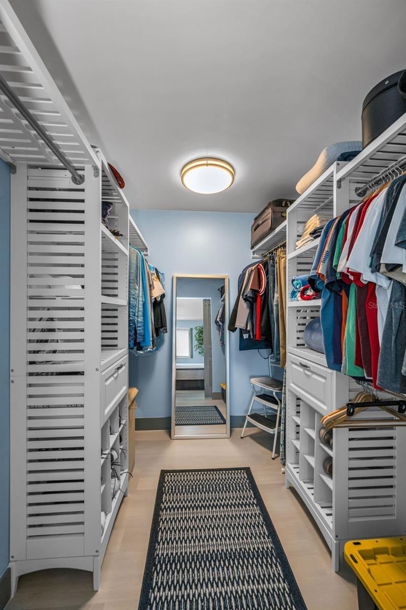 Top of the line custom closet built-out in style in Primary Bedroom.