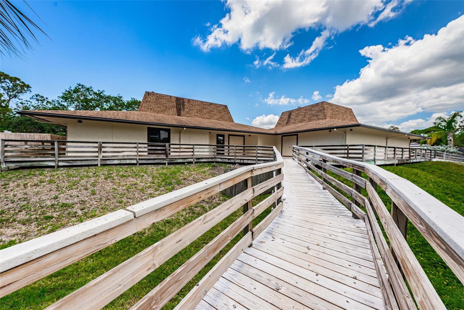 A scenic boardwalk along the Bayou takes you to the heated pool, the Association Clubhouse, the tennis courts and pickle ball courts.