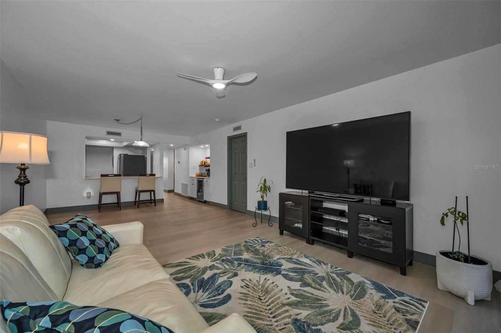 Another view of living room with new luxury vinyl plank flooring.