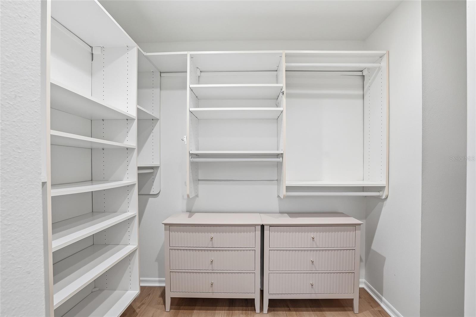 Functional primary bedroom custom closet.