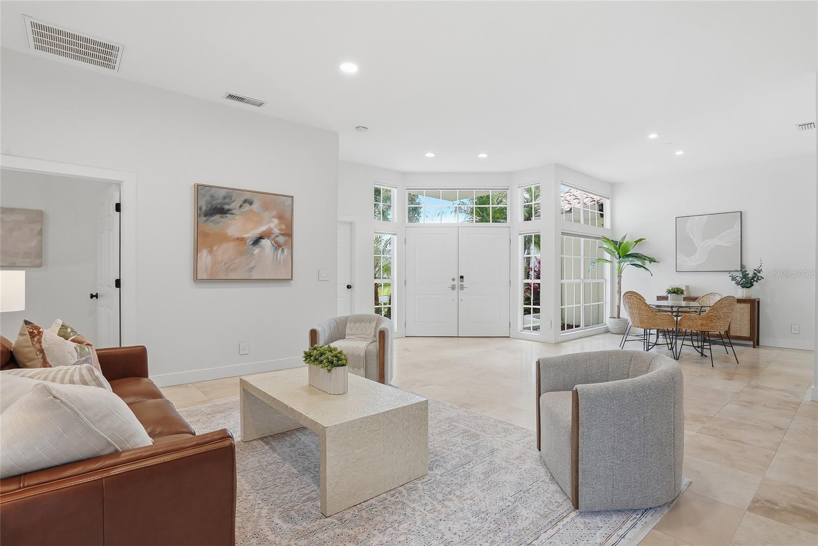 Enter through the front double doors to an inviting living area.