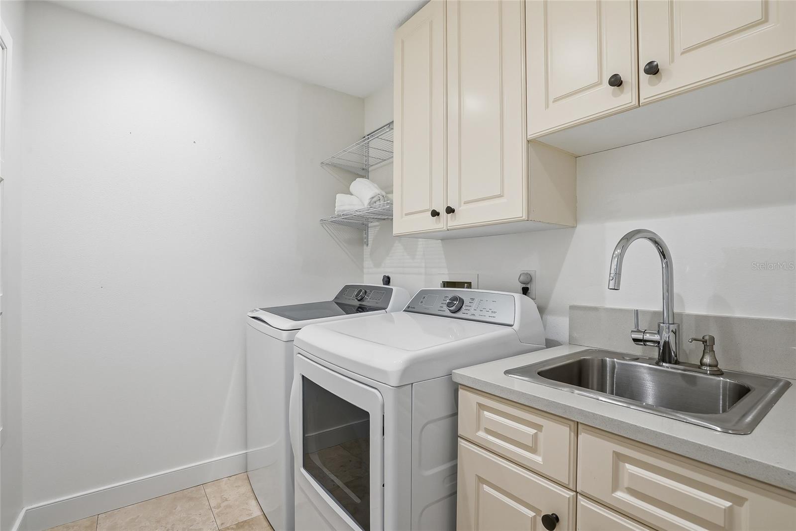 Convenient laundry room with a sink.