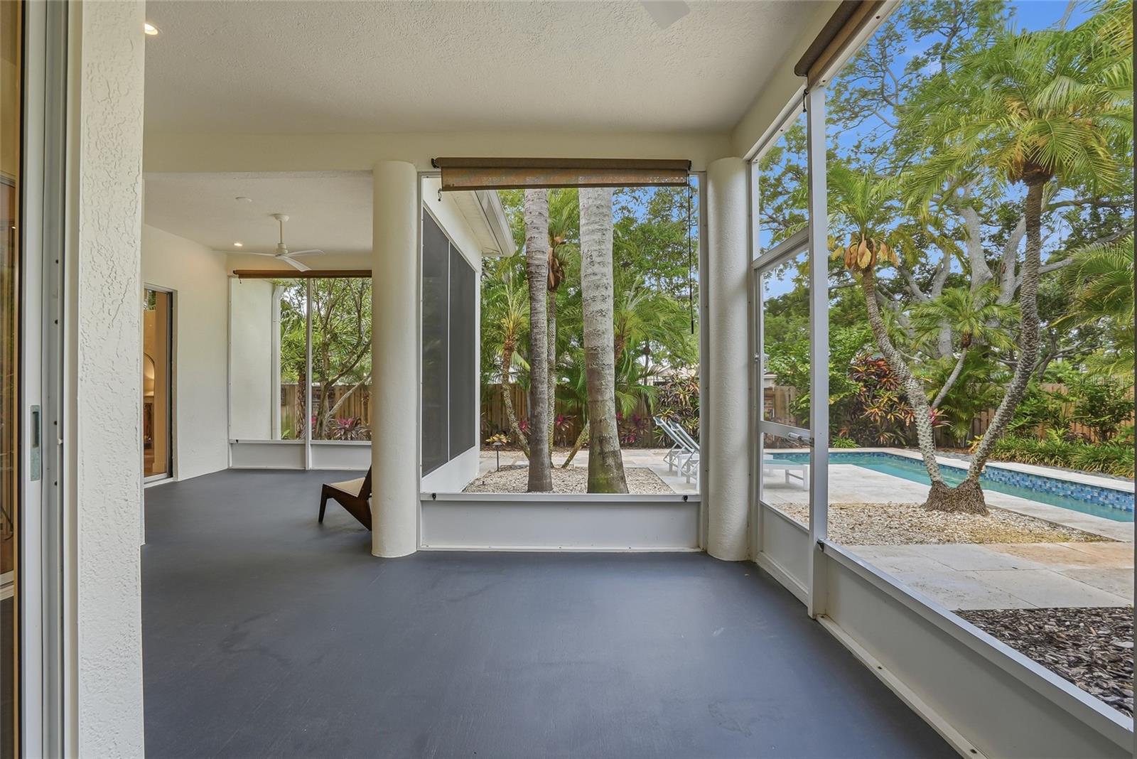 Spacious screened porchoverlooking the pool.