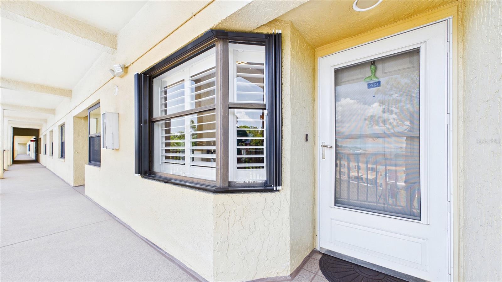 New Hurricane Shutters. Conveniently located equal distance from both the elevator and stairwell.