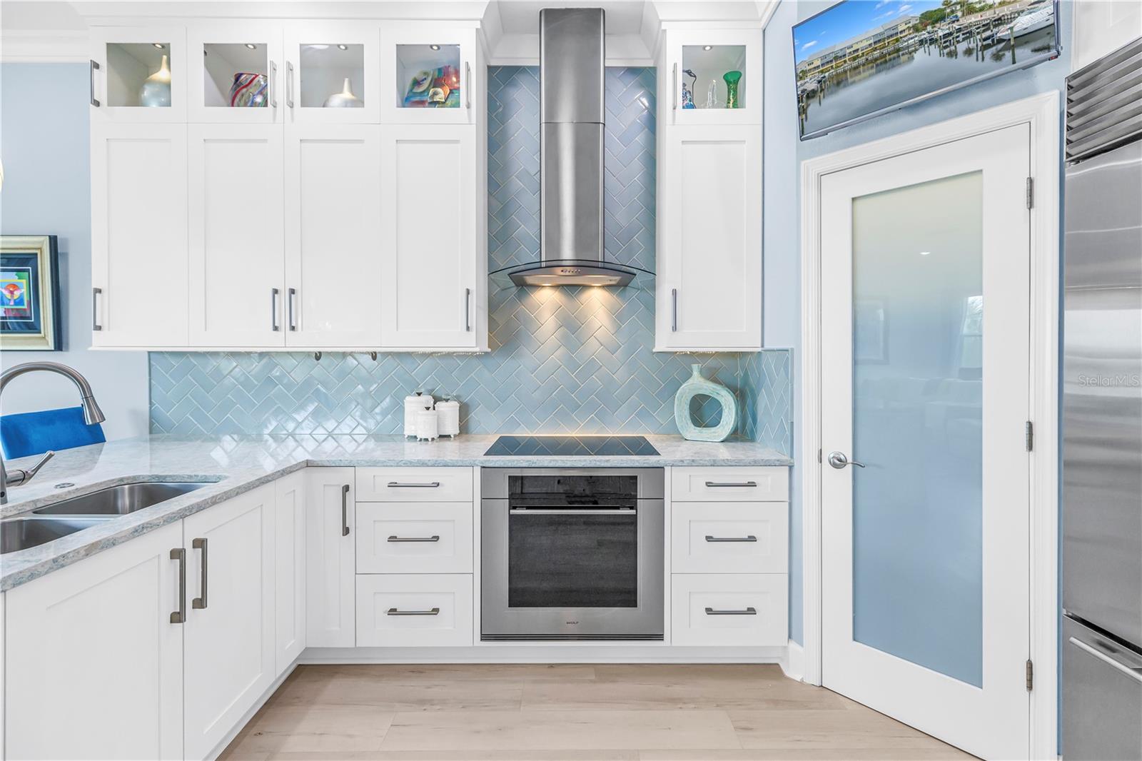 Upper Cabinets Extend to Ceiling with Lighted Display Cabinets