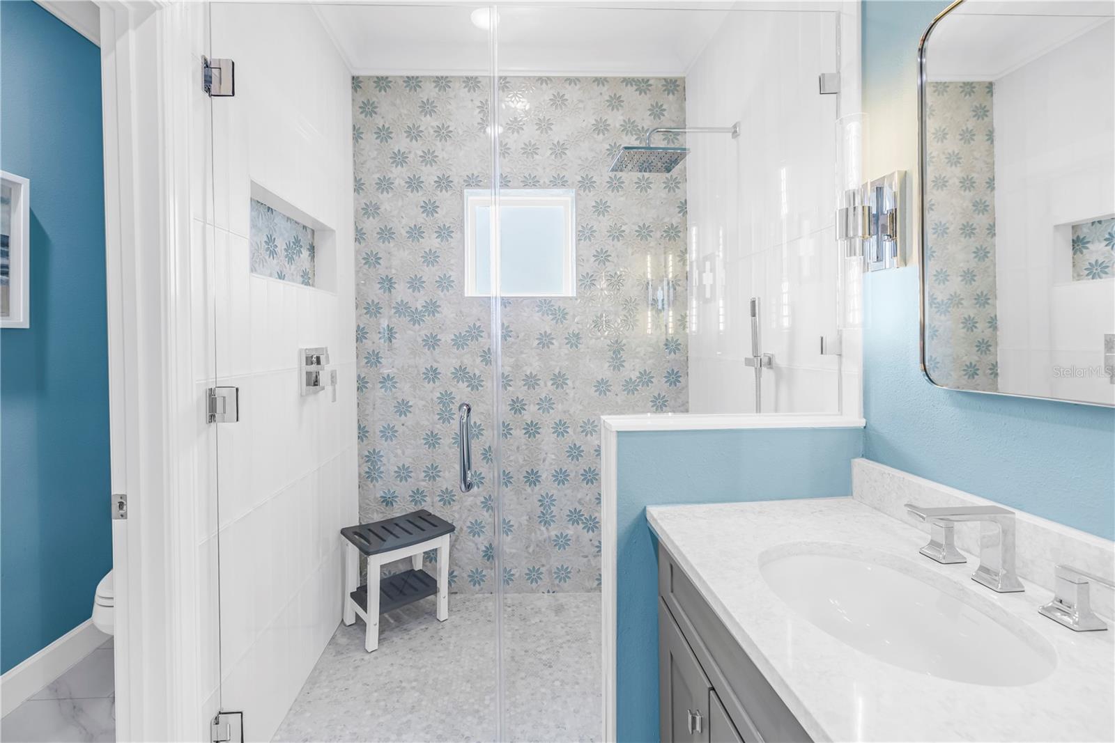 Seamless Shower with Floor to Ceiling Designer Tile
