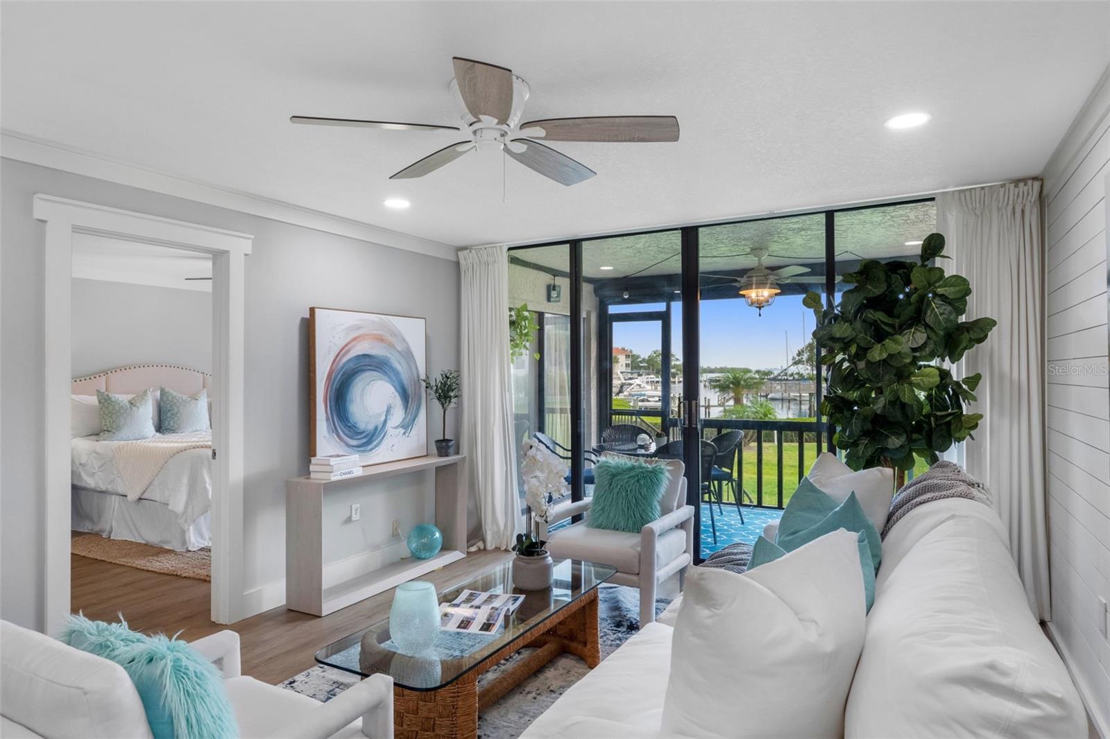 Living Room has access to the rear covered/screened porch