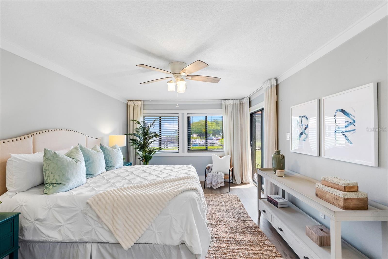 Primary Bedroom shown with King Bed and an abundance of light