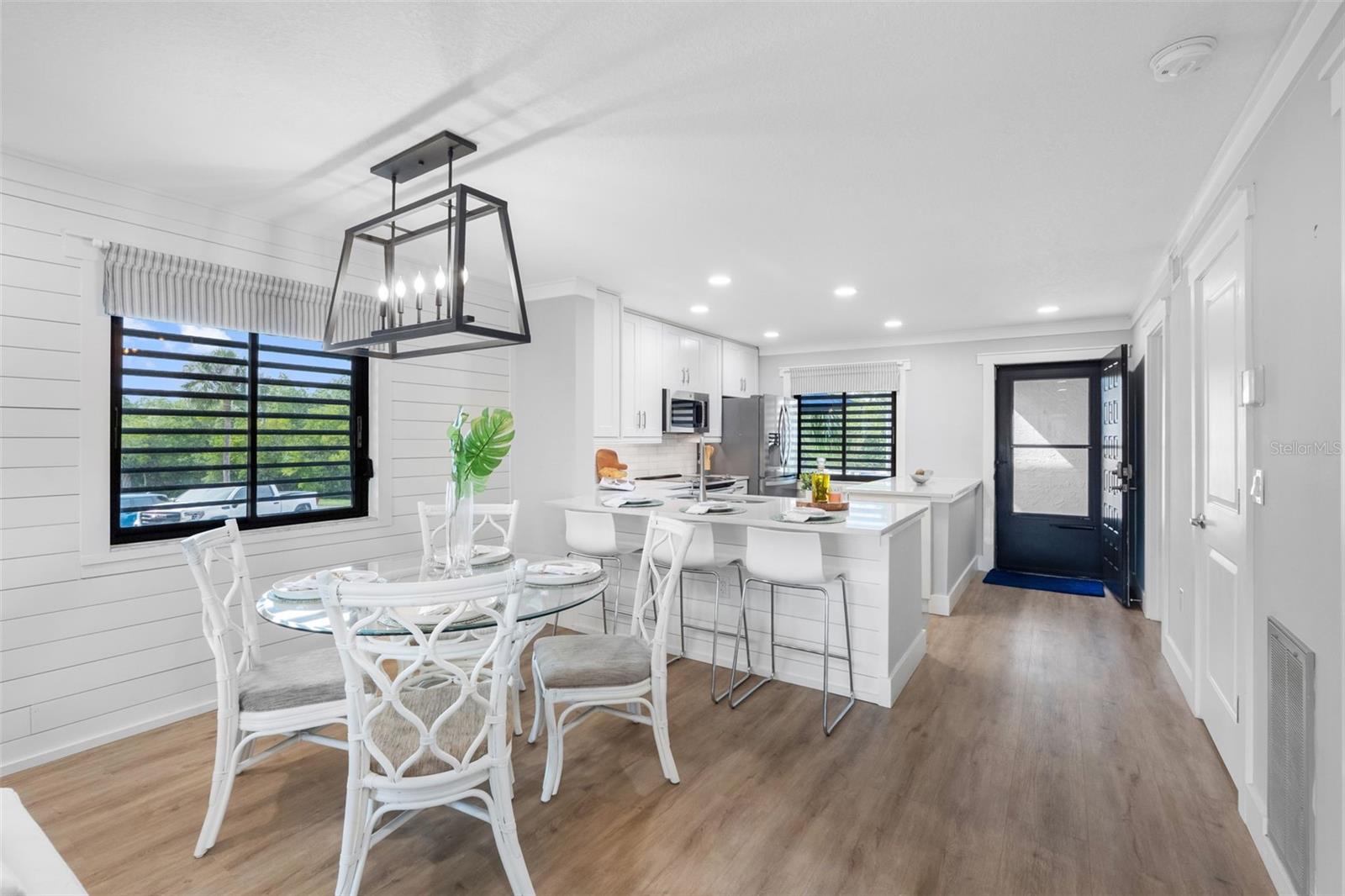 Updated lighting with open dining and Kitchen area with breakfast bar