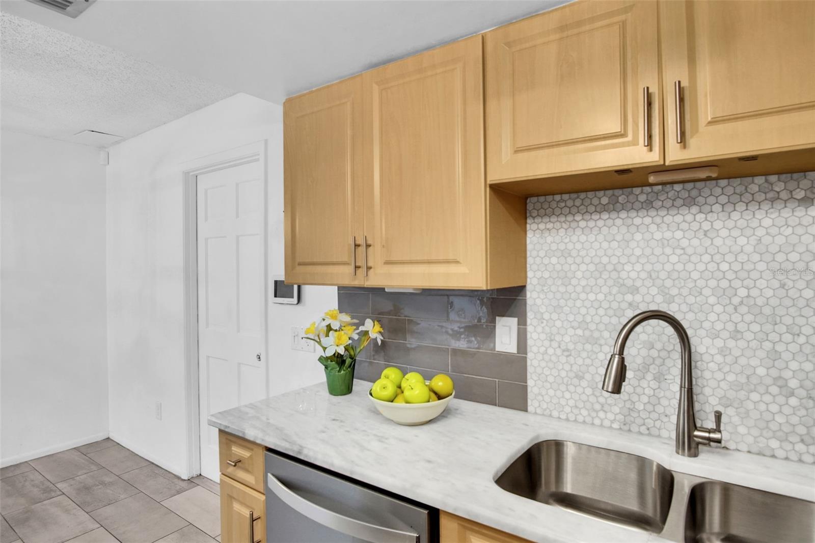 Garage access right off the kitchen/dining area ~