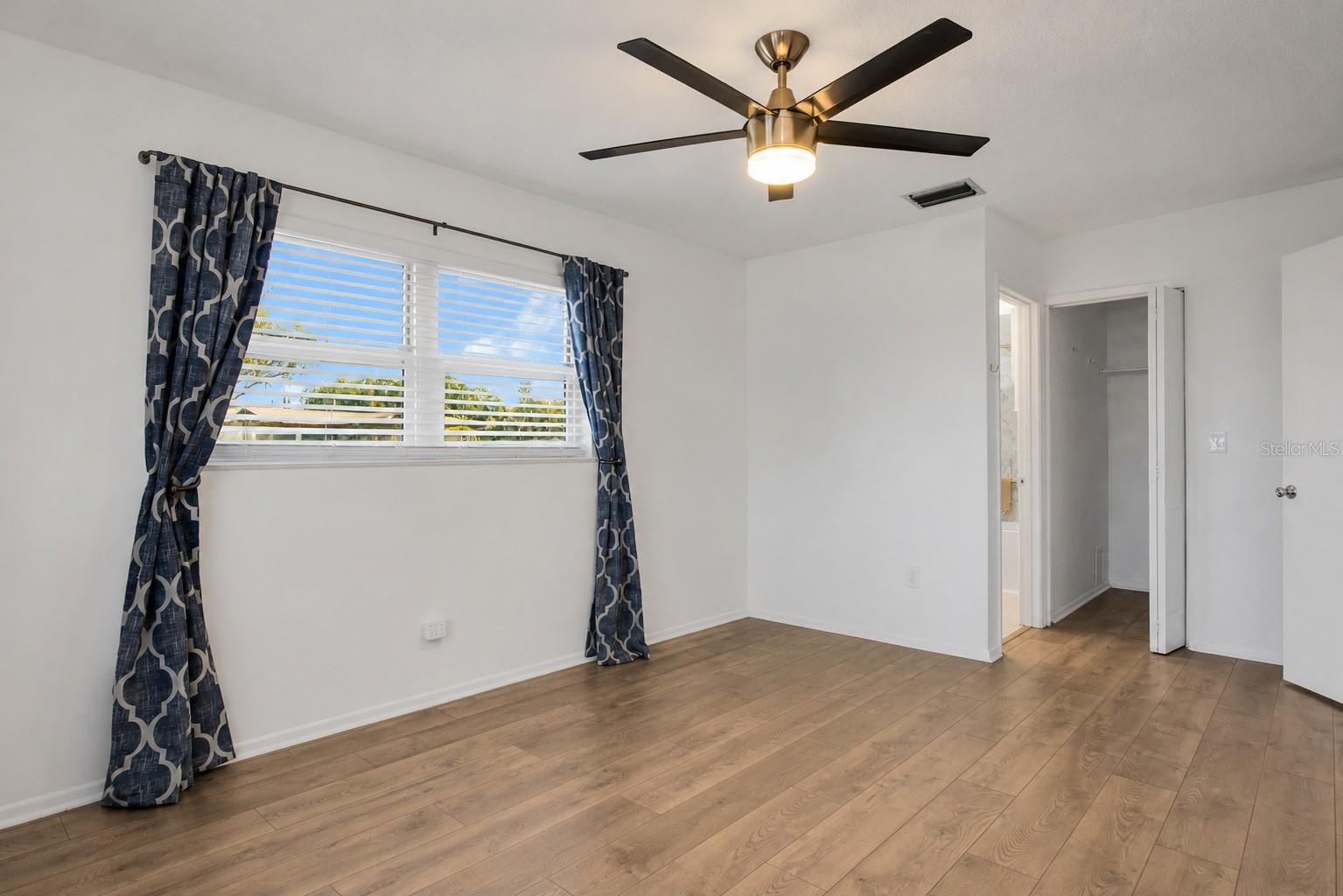 All the bedroom windows have newer vinyl blinds - modern fans and continuous luxury vinyl flooring ~