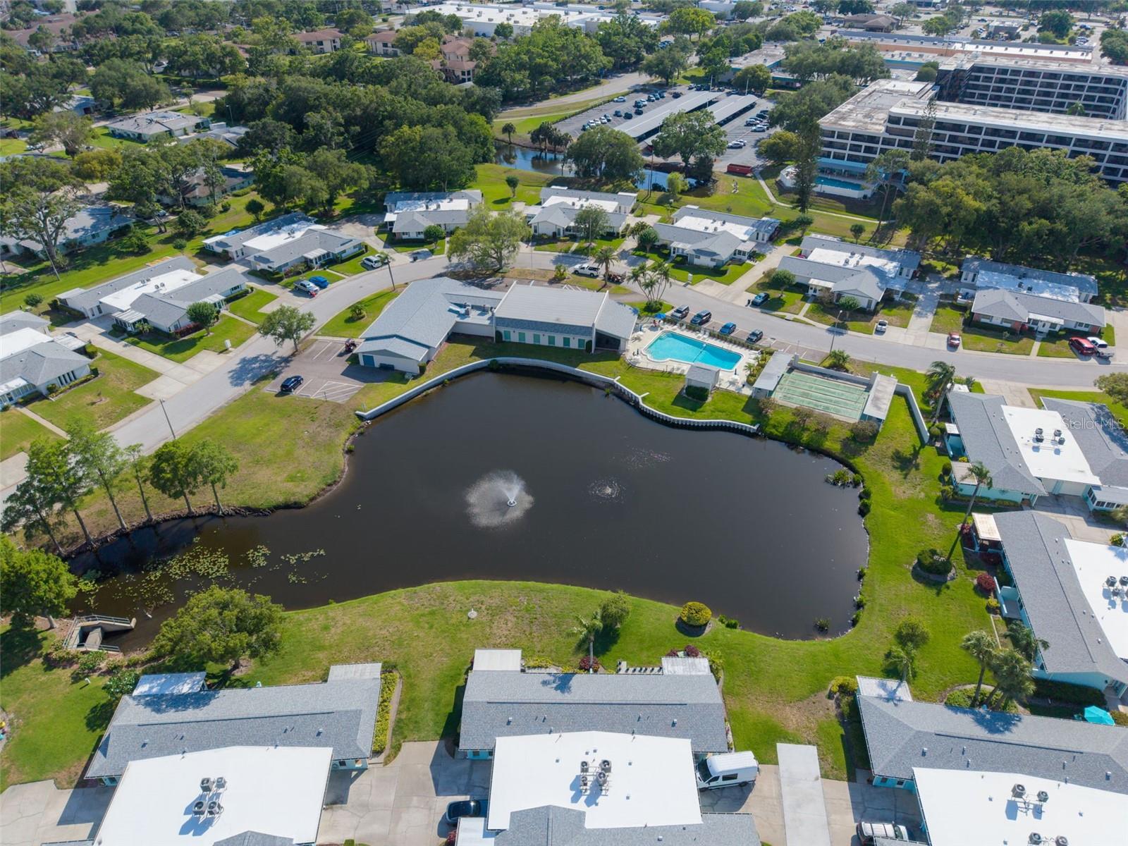 The Andover clubhouse overlooks this serene pond area~