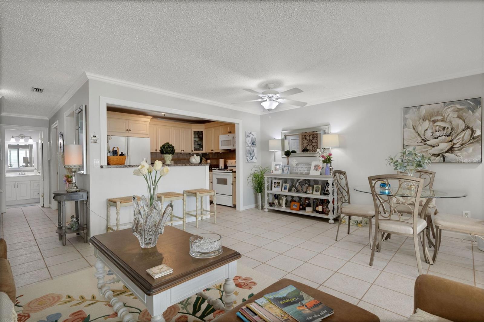 Kitchen and Breakfast Bar Open to Living Room and Dining Area