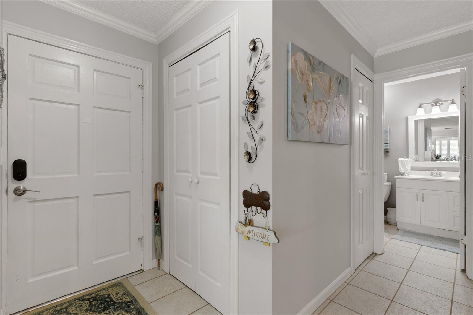 Hallway to Left of Entryway Leeds to Bath and Bedroom. Note the 2 storage Closets. One at the Entry and one Down the Hall