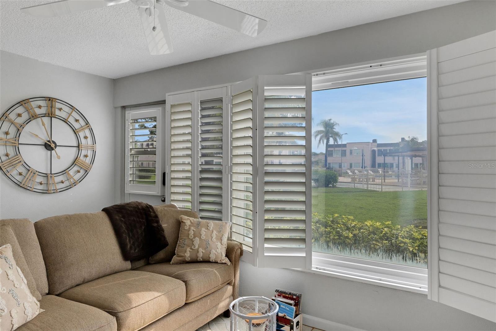Florida Room with Pedestrian Door to Pool and Clubhouse