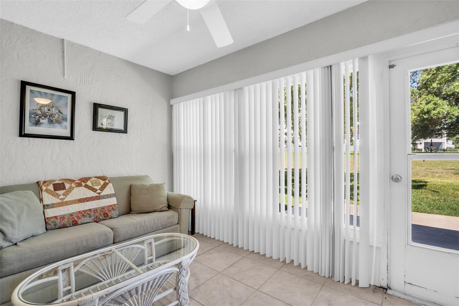 Enclosed sunroom with hurricane windows ~