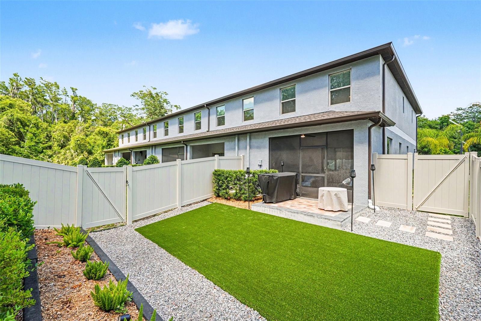 Rear-Exterior-Screened-Lanai-Private-Fenced-Yard-Townhome-Holiday-FL