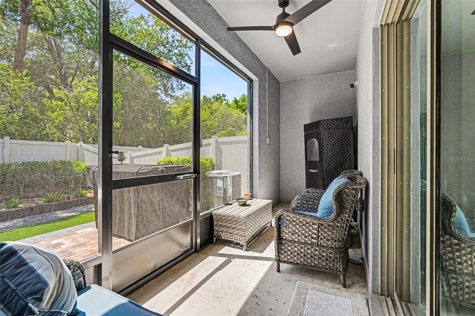 Screened-Lanai-Outdoor-Living-Space-Ceiling-Fan-Wicker-Seating-Holiday-FL