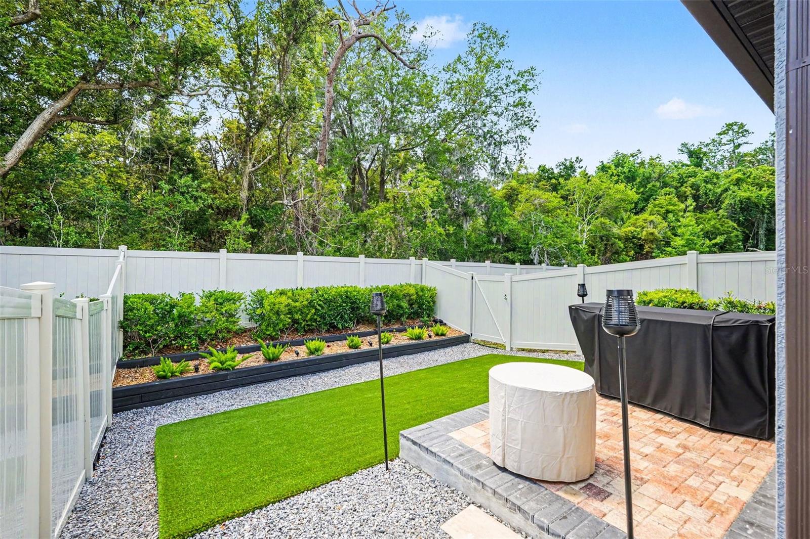 Private-Fenced-Backyard-Paver-Patio-Artificial-Turf-Outdoor-Living-Holiday-FL
