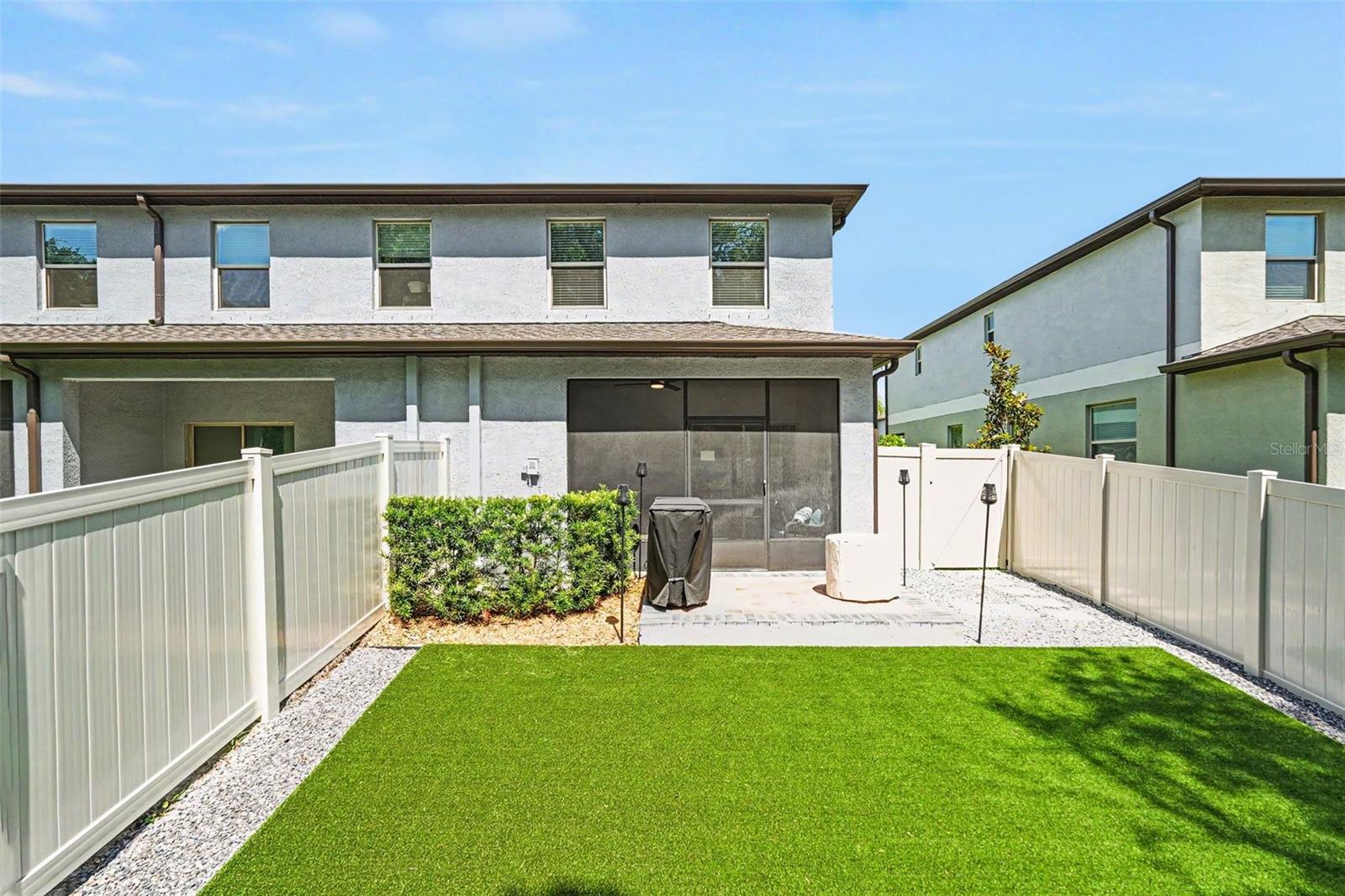 Rear-Exterior-Fully-Fenced-Yard-Artificial-Turf-Patio-Holiday-FL