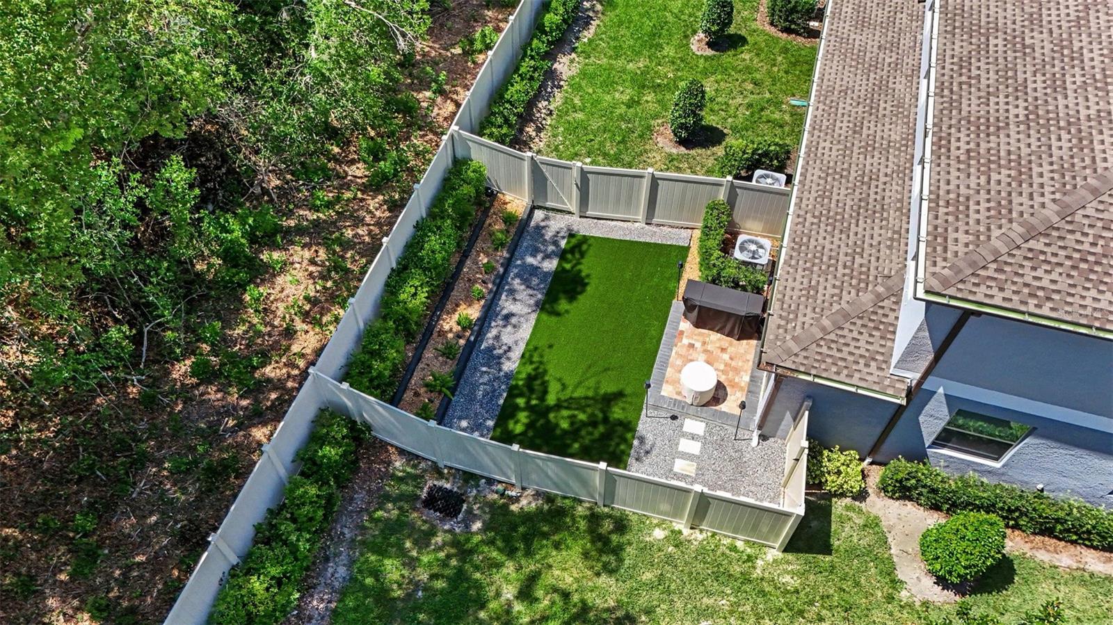 Private-Fenced-Backyard-Aerial-View-Artificial-Turf-Paver-Patio-Holiday-FL-34690