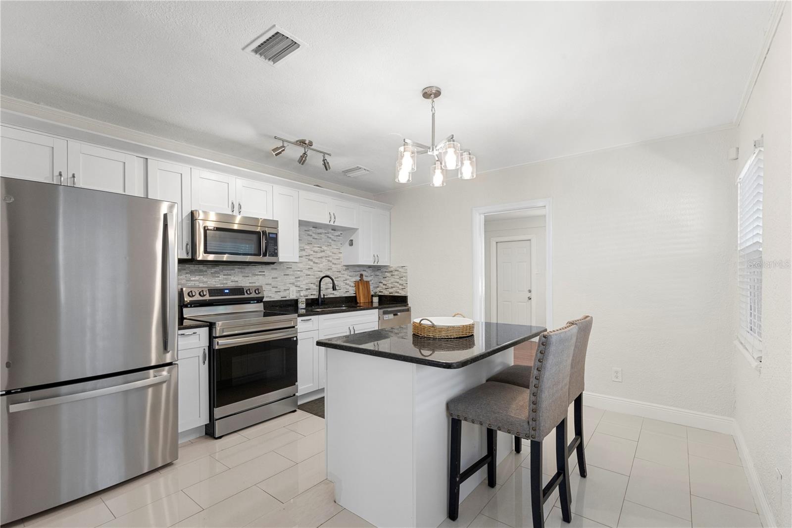 Kitchen with opening to bedroom #3 or office