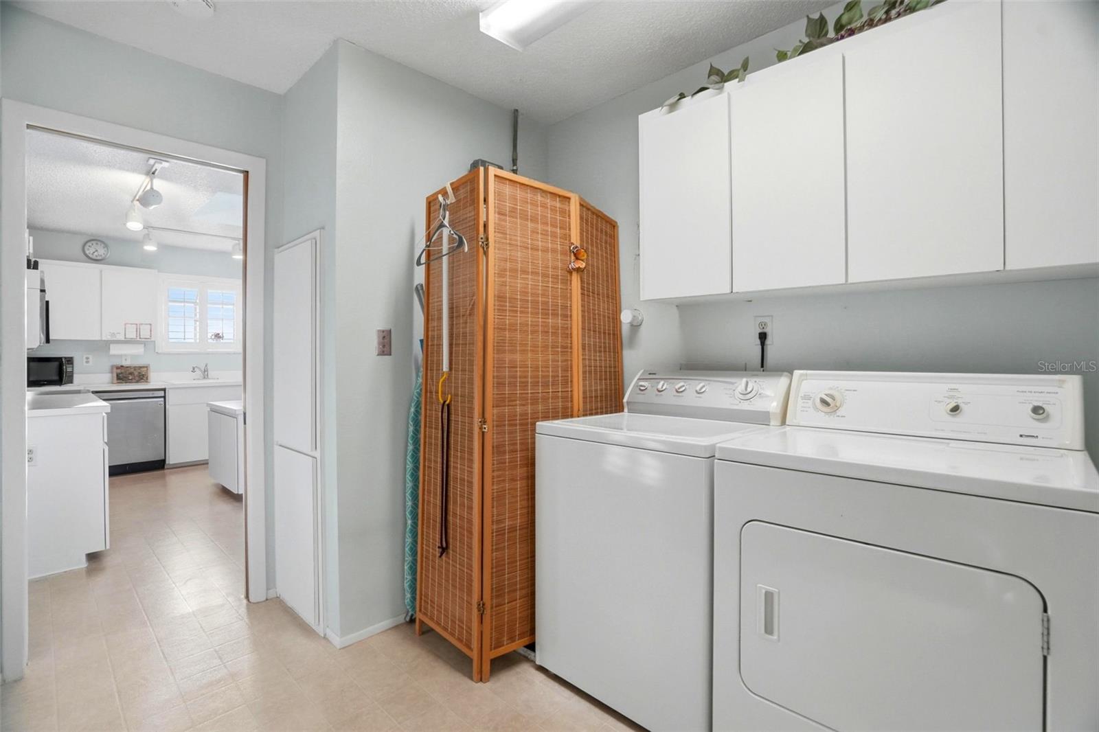Laundry room next to kitchen.