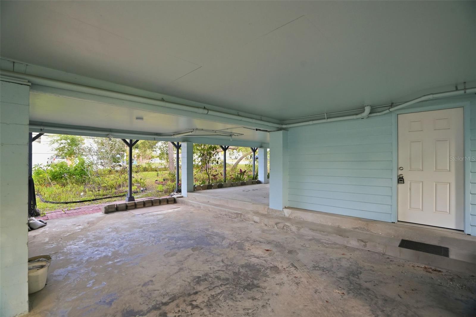 This door leads into the home via a utility room.