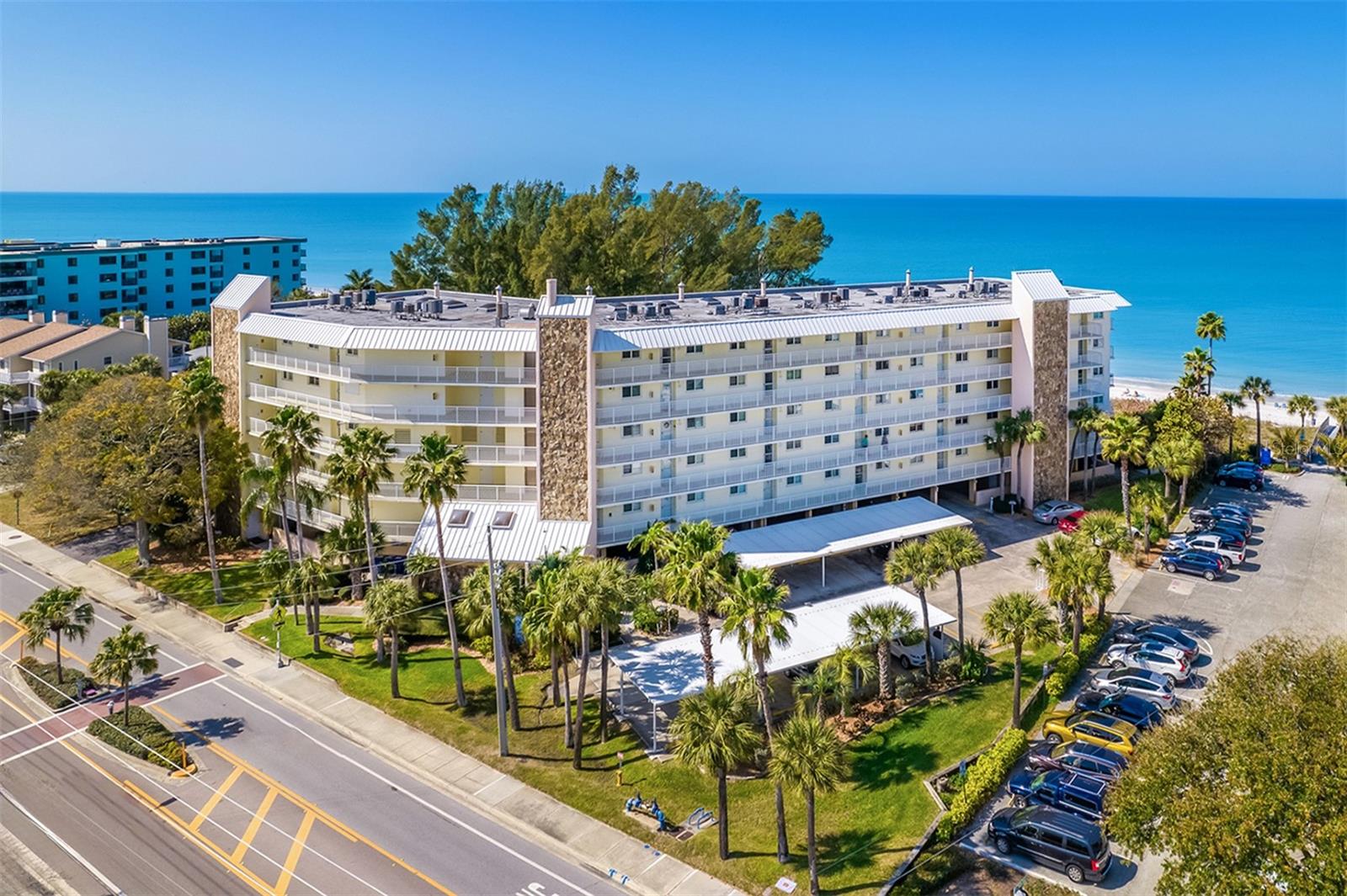 Dolphin Reef sits ON the ivory beach sands of IndianRocks Beach