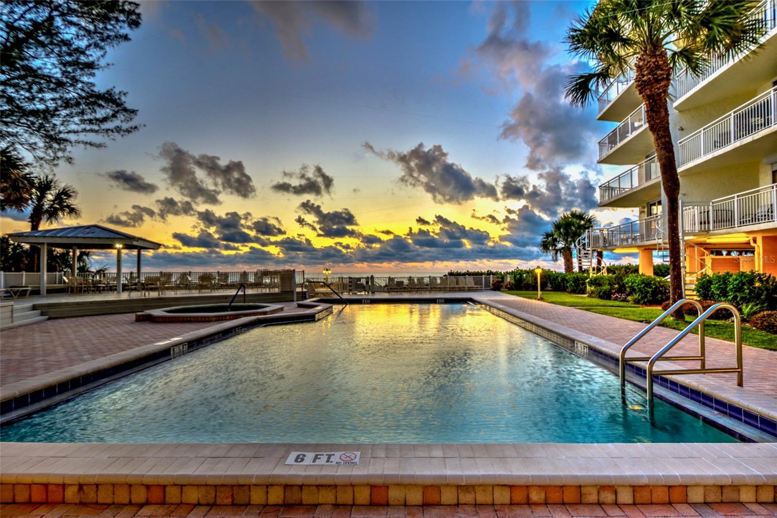 Seaside pool/spa, deck and outdoor kitchen is glorious at Sunset