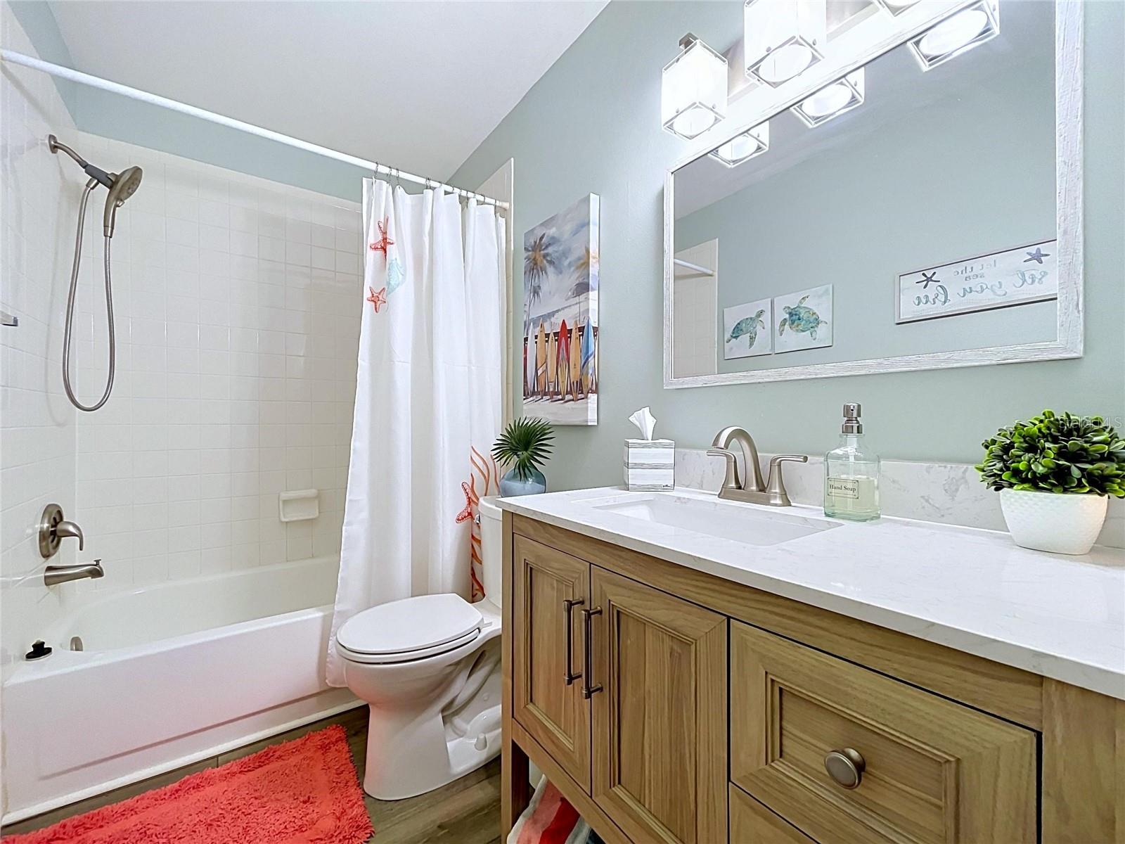Guest bath has tub/shower