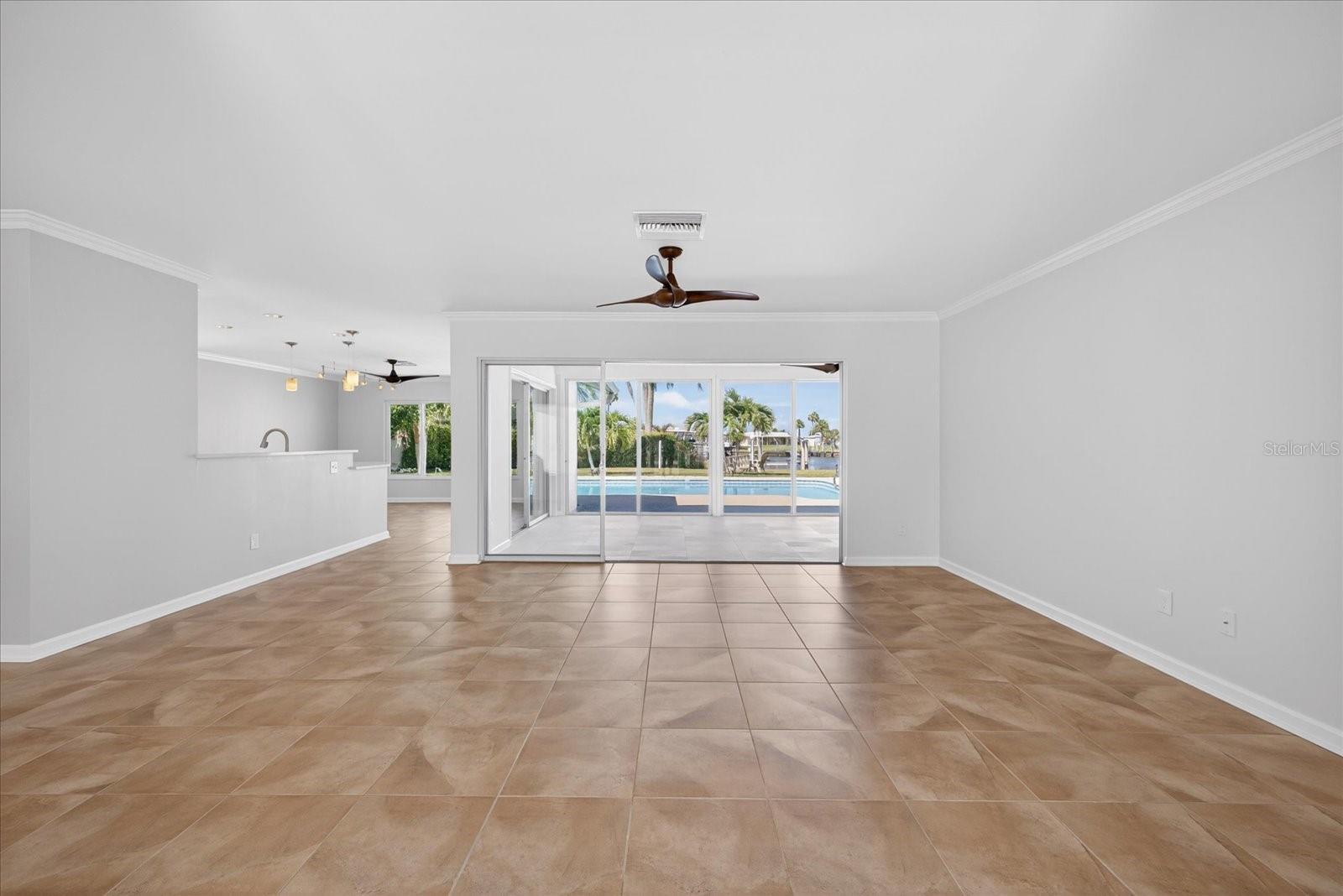 Enter this home and be wowed! Wide open floor plan. You are greeted with amazing pool and water views!