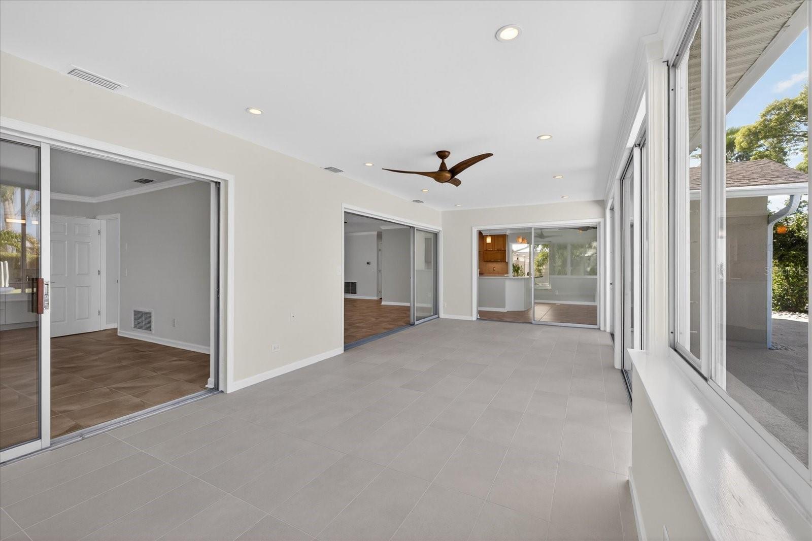 Florida Room with sliders into Primary Bedroom and Great Room