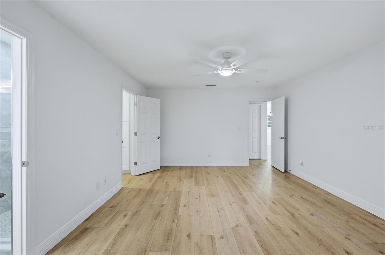 Primary bedroom from back to front.  Garage is just across the hall
