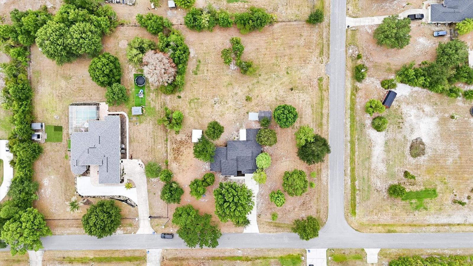 Overhead aerial shows how well spaced out the properties are!  Convenient corner lot provides access from side street into back yard if desired