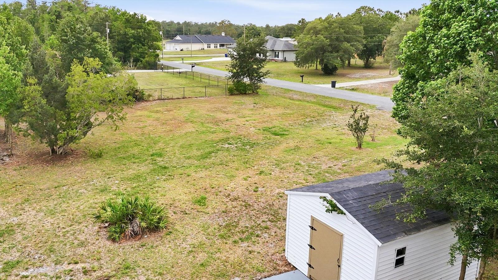 Access the backyard from the side street for added convenience